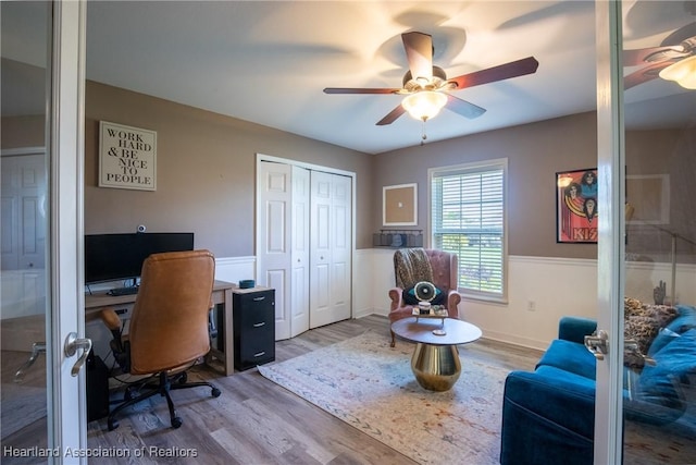 office space with ceiling fan and wood finished floors