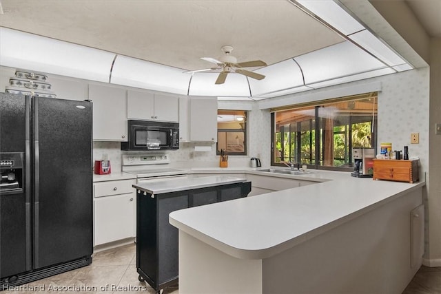 kitchen featuring black appliances, white cabinets, sink, ceiling fan, and tasteful backsplash