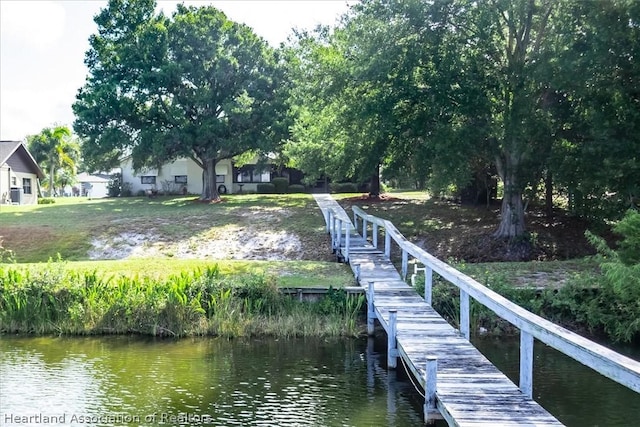 dock area featuring a water view