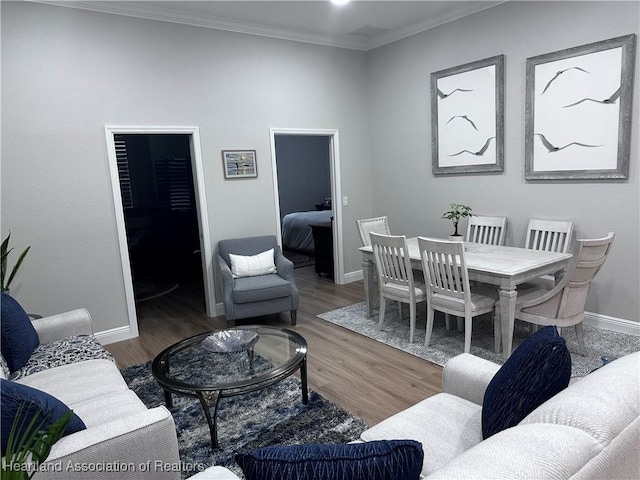 living room featuring crown molding and hardwood / wood-style floors