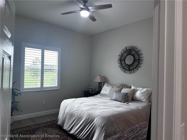 bedroom with hardwood / wood-style flooring and ceiling fan