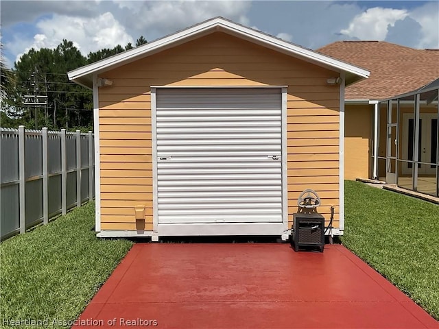 view of outdoor structure with a lawn