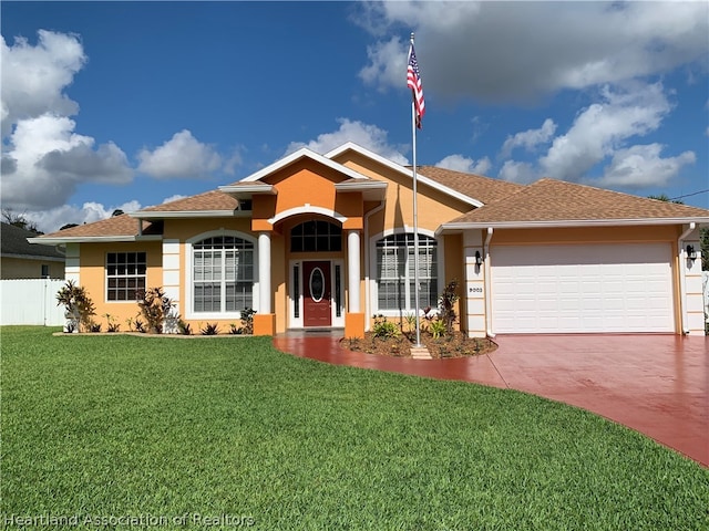 ranch-style house with a front yard and a garage