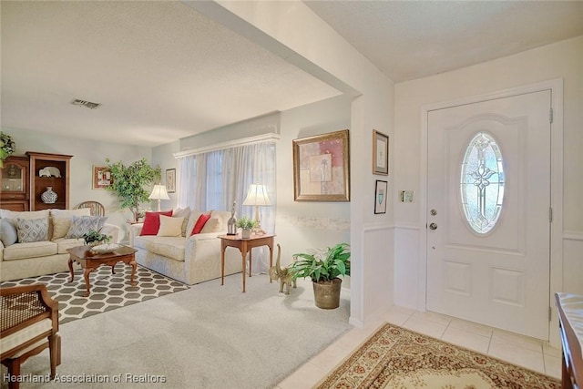 entryway with light tile patterned floors