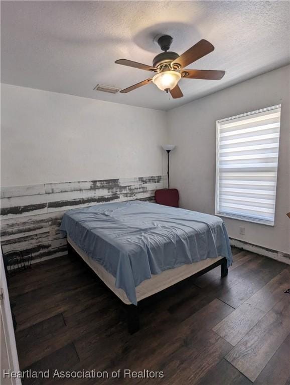 2146 Hartman Rd, Avon Park, FL 33825 - bedroom featuring wood-type flooring, a textured ceiling, and ceiling fan