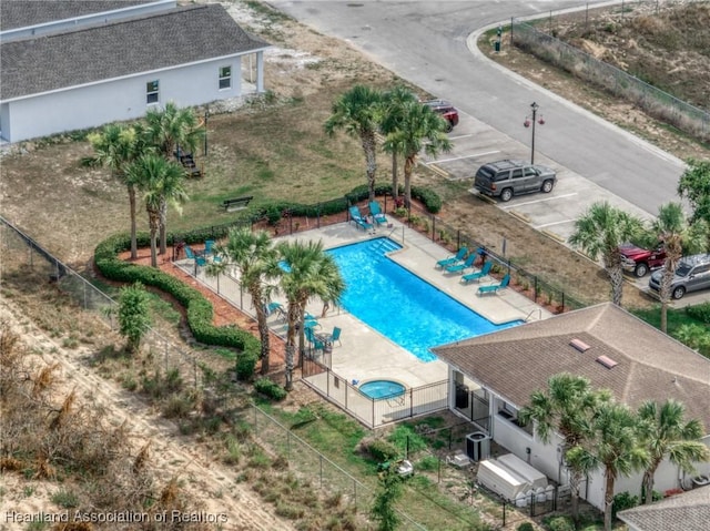 view of swimming pool featuring central AC unit