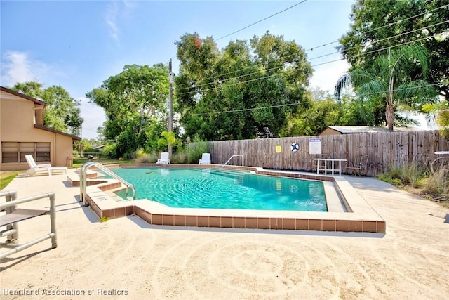 view of pool featuring a patio