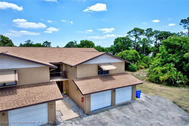 view of front of house with a balcony and a garage