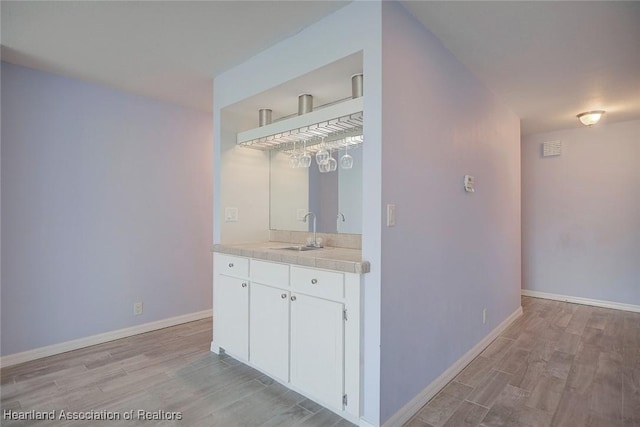 bathroom with wood-type flooring and vanity