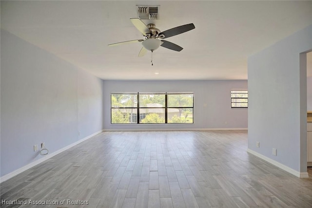 spare room with ceiling fan and light hardwood / wood-style floors