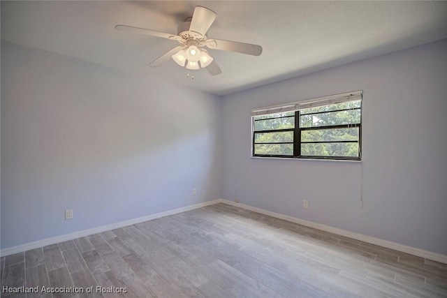 unfurnished room with ceiling fan and light hardwood / wood-style flooring