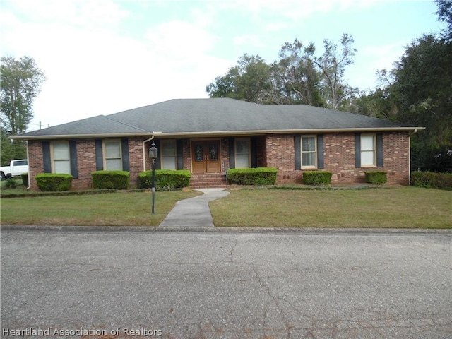 ranch-style house with a front yard