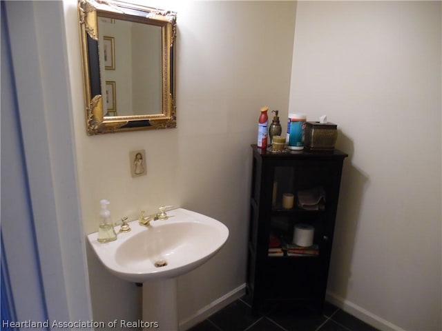 bathroom with tile patterned flooring and sink