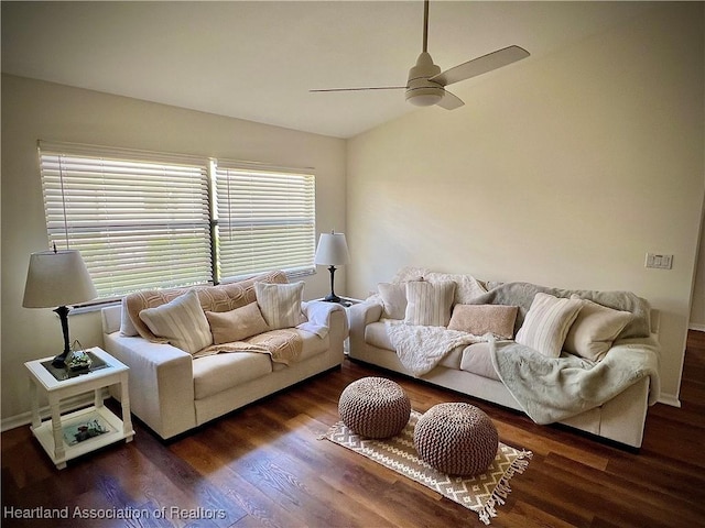 living room featuring ceiling fan, lofted ceiling, and dark hardwood / wood-style flooring