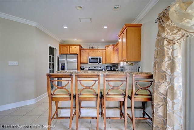 kitchen with ornamental molding, stainless steel appliances, kitchen peninsula, and light tile patterned floors