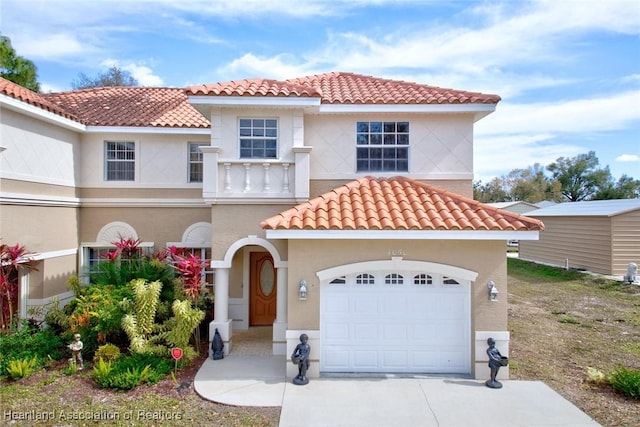 mediterranean / spanish house featuring a garage