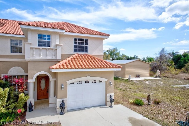 mediterranean / spanish-style home featuring a garage