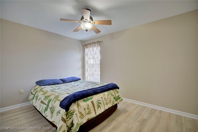 bedroom featuring ceiling fan and light wood-type flooring