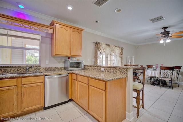 kitchen featuring sink, light stone counters, crown molding, appliances with stainless steel finishes, and kitchen peninsula