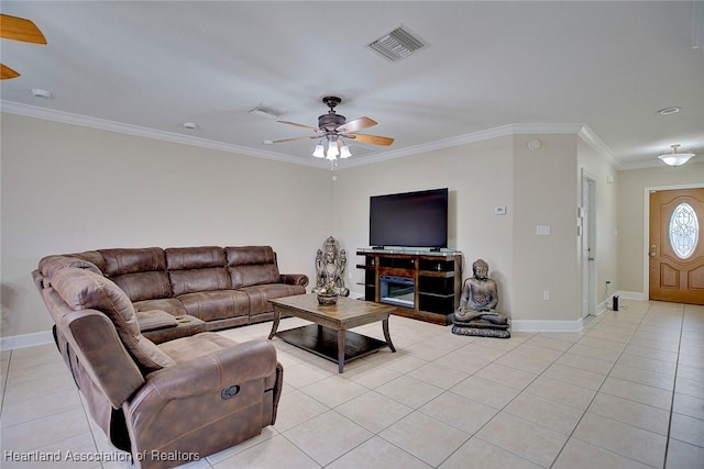 tiled living room with ceiling fan and ornamental molding