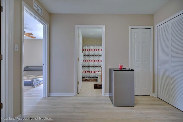 hallway featuring light wood-type flooring