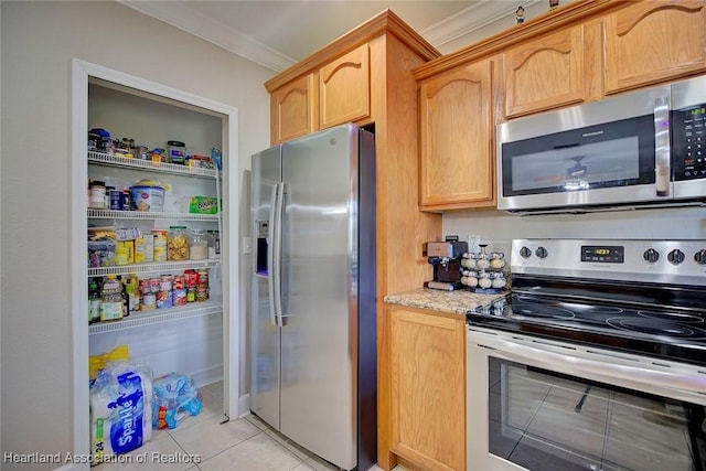 kitchen with light tile patterned floors, crown molding, stainless steel appliances, light stone countertops, and light brown cabinetry