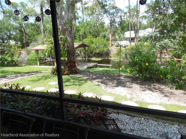 1605 Lake Clay Dr, Lake Placid, FL 33852 - view of green lawn featuring a water view