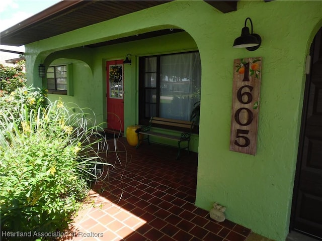 1605 Lake Clay Dr, Lake Placid, FL 33852 - doorway to property featuring stucco siding