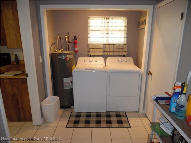1605 Lake Clay Dr, Lake Placid, FL 33852 - laundry room with electric water heater, washing machine and dryer, and light tile patterned floors