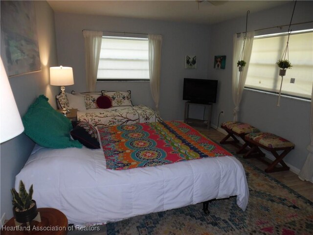 1605 Lake Clay Dr, Lake Placid, FL 33852 - bedroom featuring wood finished floors and baseboards