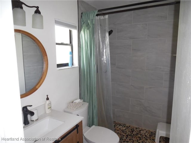 1605 Lake Clay Dr, Lake Placid, FL 33852 - full bathroom featuring toilet, a tile shower, and vanity