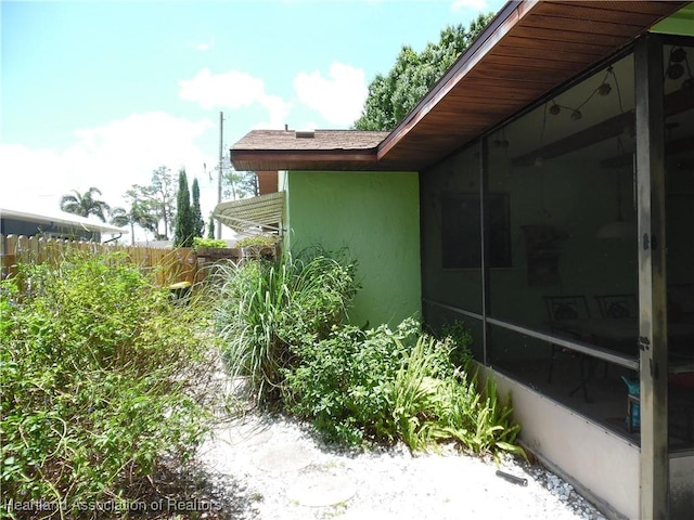 1605 Lake Clay Dr, Lake Placid, FL 33852 - view of property exterior featuring stucco siding and fence