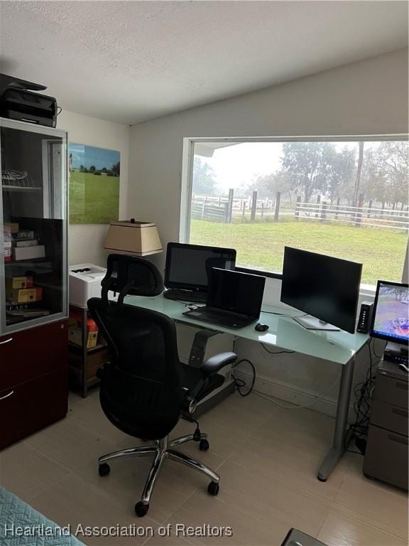 office area featuring a textured ceiling