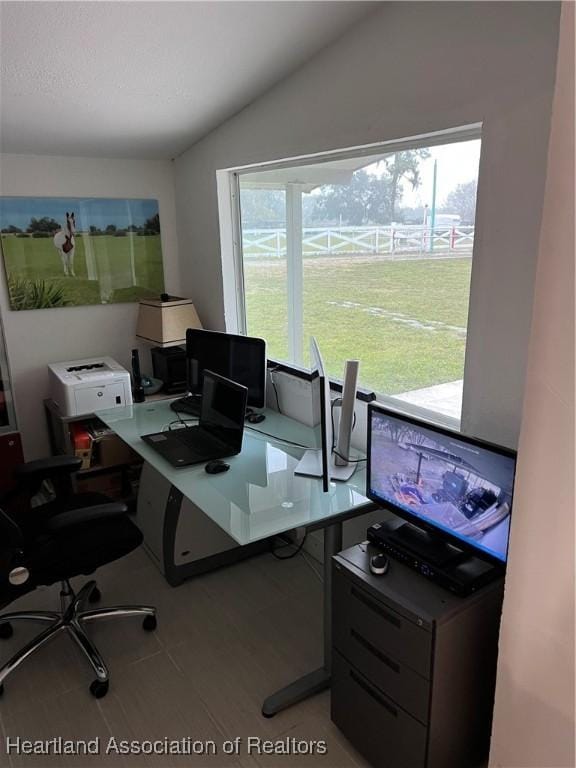 office area with lofted ceiling