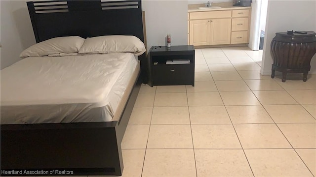 tiled bedroom featuring sink