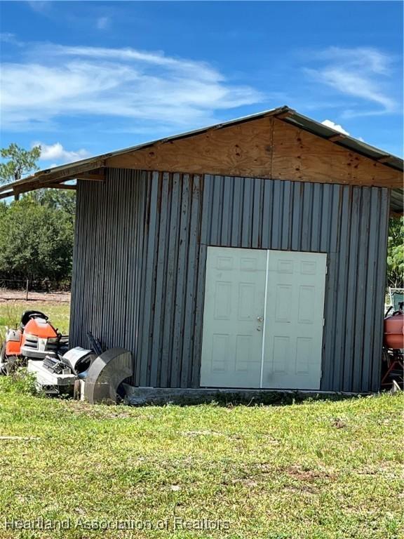 garage with a lawn