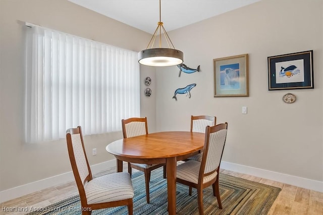 dining space featuring light hardwood / wood-style flooring