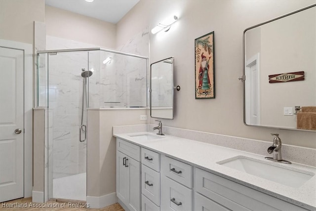 bathroom featuring tile patterned flooring, vanity, and a shower with shower door