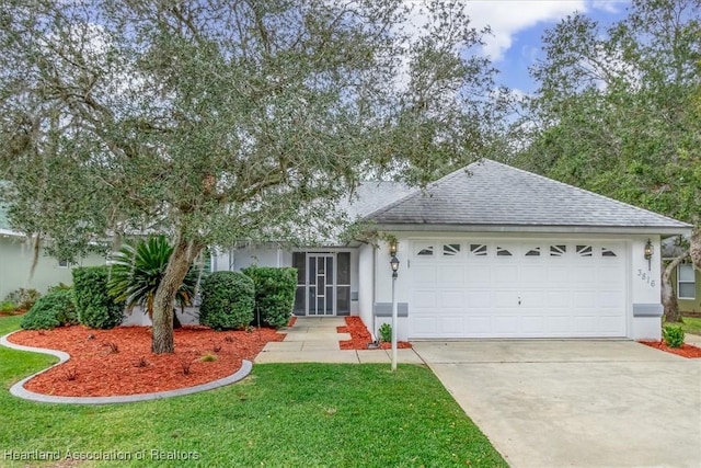 view of front facade featuring a front yard and a garage