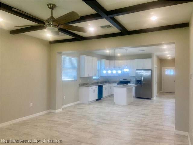 kitchen featuring a center island, coffered ceiling, appliances with stainless steel finishes, beam ceiling, and white cabinetry