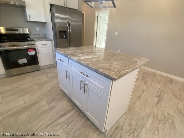 kitchen with white cabinetry, light stone counters, ventilation hood, a kitchen island, and appliances with stainless steel finishes