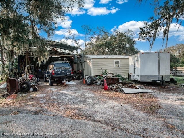 exterior space featuring a carport and driveway