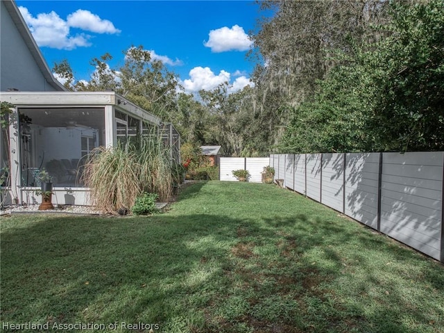 view of yard with a sunroom