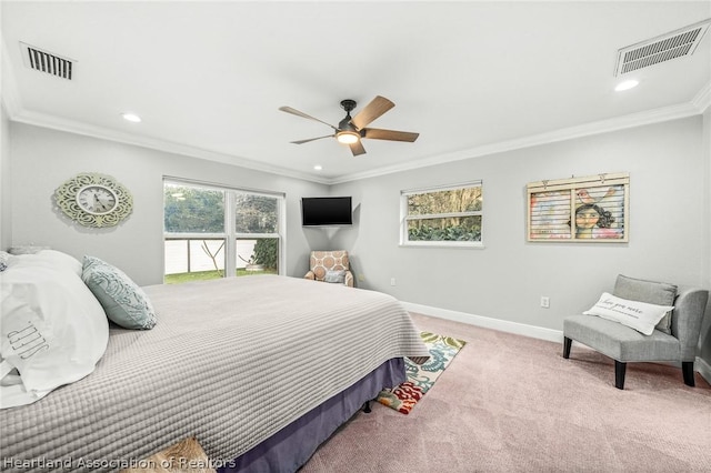 bedroom featuring light colored carpet, ceiling fan, and crown molding