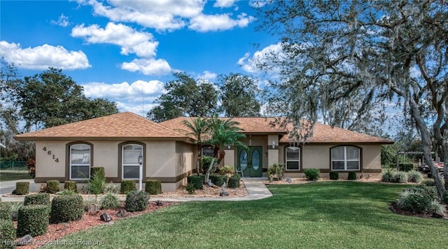 ranch-style home with a front yard