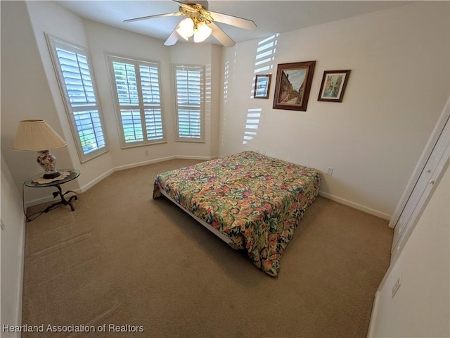 bedroom with ceiling fan and carpet floors