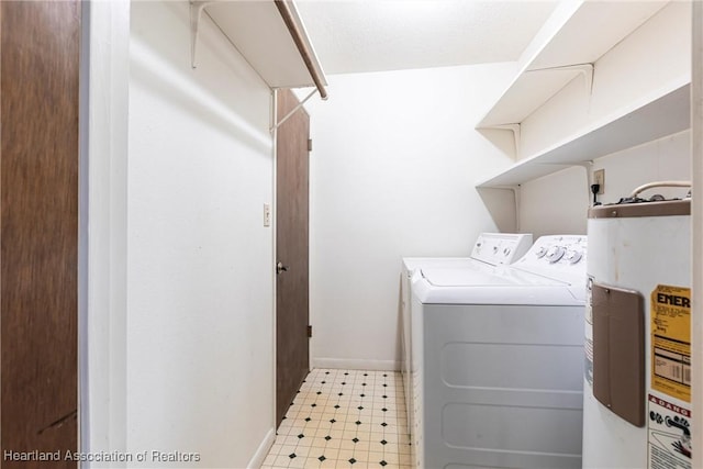 1811 Jackson Dr, Sebring, FL 33870 - washroom featuring washer and clothes dryer, light floors, laundry area, baseboards, and electric water heater
