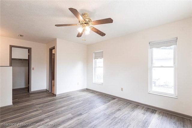 1811 Jackson Dr, Sebring, FL 33870 - spare room with visible vents, baseboards, ceiling fan, and wood finished floors