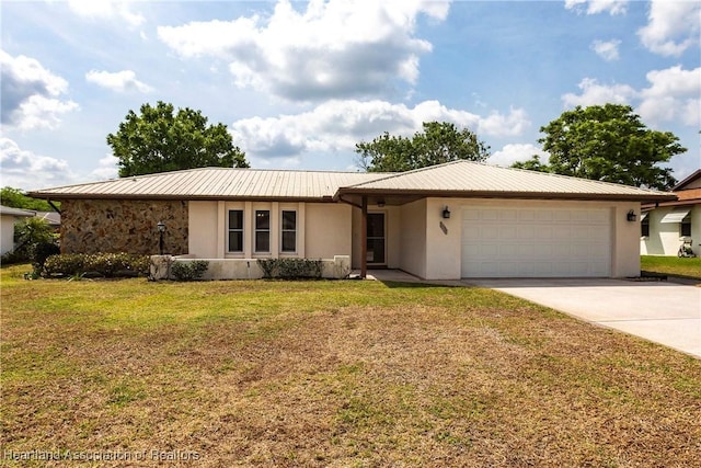 1811 Jackson Dr, Sebring, FL 33870 - single story home featuring metal roof, an attached garage, concrete driveway, a front yard, and stucco siding