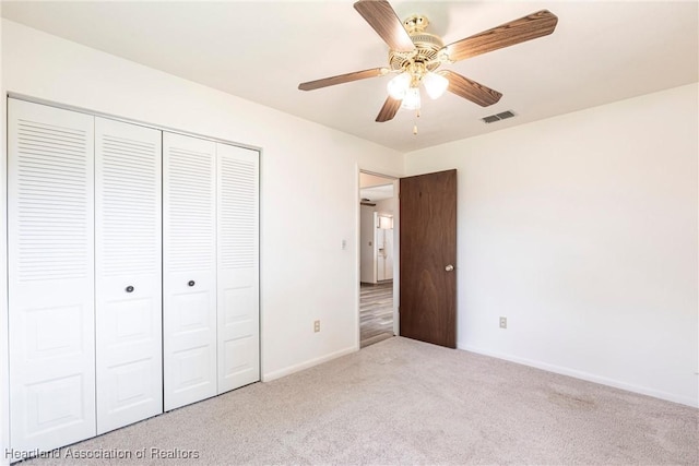 1811 Jackson Dr, Sebring, FL 33870 - unfurnished bedroom with carpet, baseboards, ceiling fan, visible vents, and a closet